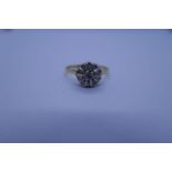 18ct yellow gold diamond ring with raised central diamond surrounded 10 small diamonds in circular p