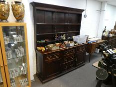 1 19th century style oak dresser and rackback having three drawers with cupboards below, 181cms