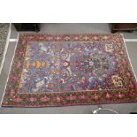 A Persian prayer style rug decorated birds and animals in a turquoise field, 197 x 131 cms