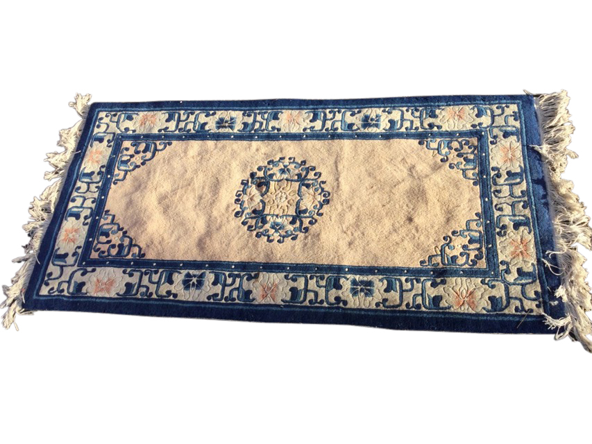 A Chinese thick pile rug woven with central foliate scrolled circular medallion and spandrels on