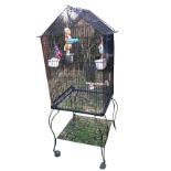 A square birdcage on stand with casters, having pitched roof, internal feeding trays & perches,