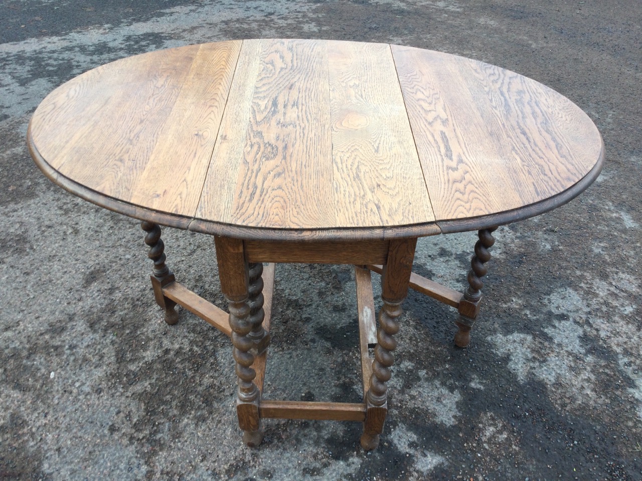 An oval oak gateleg table, the moulded top on barleytwist legs joined by rectangular stretchers, - Image 3 of 3