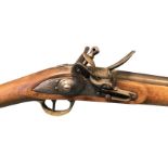 A nineteenth century flintlock carbine rifle by Tower, with working hammer and lock engraved with