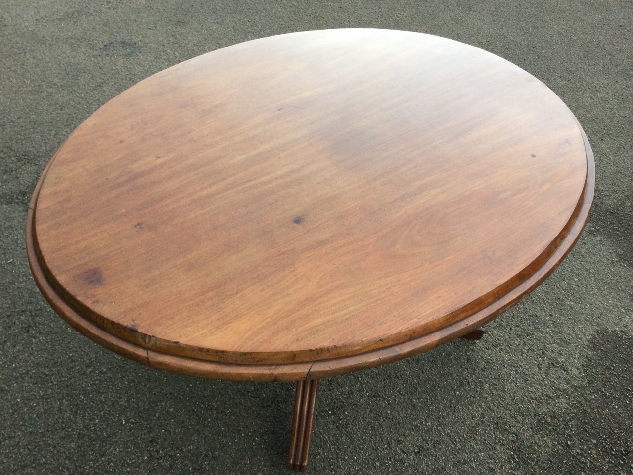 An oval nineteenth century mahogany breakfast table, the moulded top supported on a fluted - Image 3 of 3