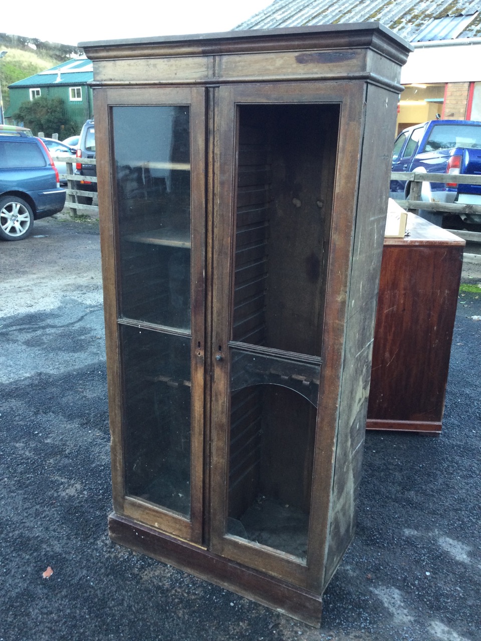 A nineteenth century glazed mahogany cupboard with moulded cornice above two doors enclosing - Image 3 of 3