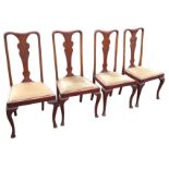 A set of four Queen Anne style mahogany dining chairs with vase shaped splats above drop-in