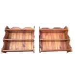 A pair of pine wall shelves with shaped moulded sides and tongue & grooved backs, each piece with