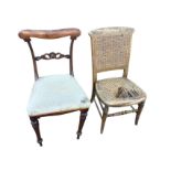 A Victorian rosewood chair with shaped back rail above a pierced scroll carved joining rail, the