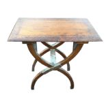 A late nineteenth century carved hardwood table, the rectangular moulded top with decorative
