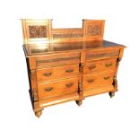 A late Victorian mahogany dresser with foliate scrolled carved panels to back, the rectangular