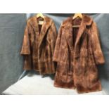 A ladies fur coat by Marcus of London, Edinburgh and Newcastle - mid-thigh length, lined, with
