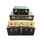 An Edwardian leather vanity case with brass mounts, having fitted interior; a studded school