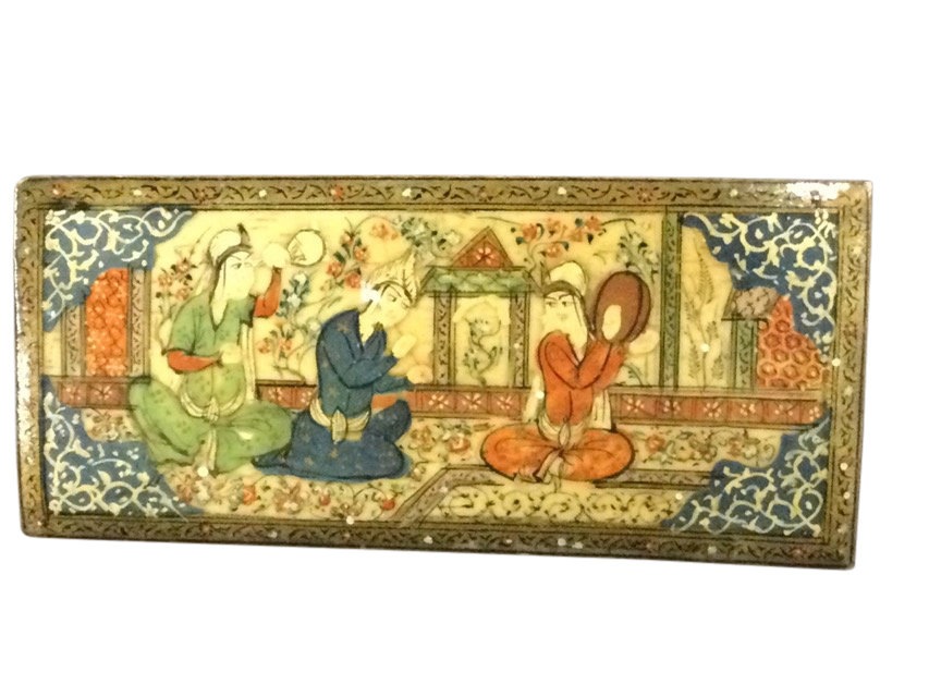 A Persian ivory panel, dated to verso Tehran 1945 with inscription, painted with three seated