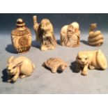 Seven oriental style ornamental pieces - a snake, a bearded figure with staff, a hare, a tiger, a