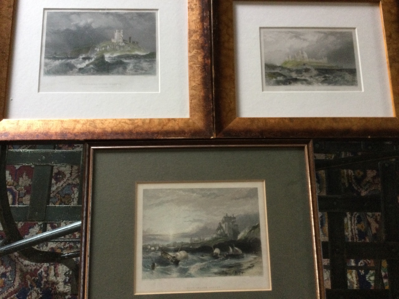 A pair of mounted and gilt framed nineteenth century handcoloured steel engravings of Dunstanburgh
