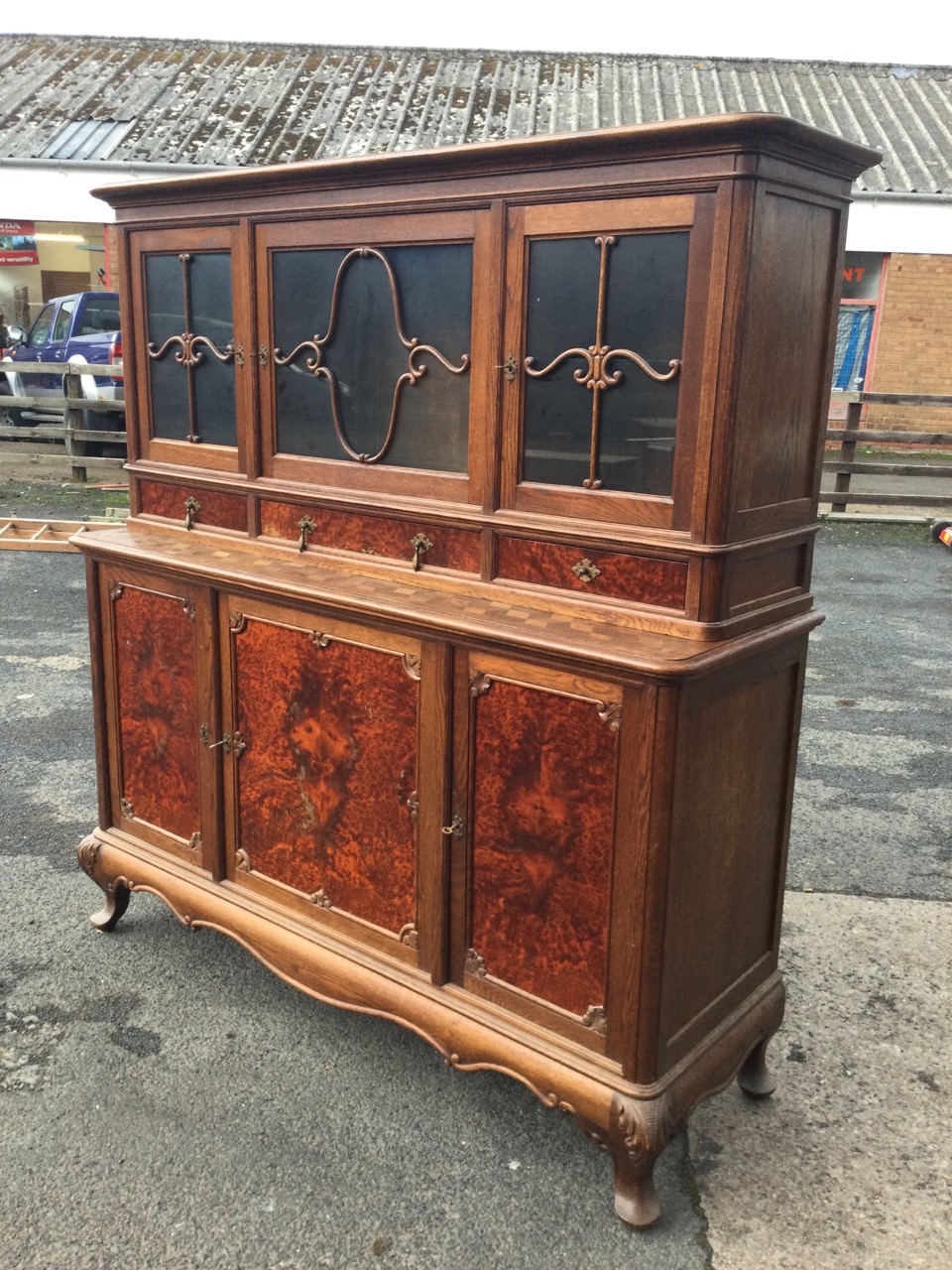 A French oak and burr walnut buffet, the top with moulded cornice above three glazed doors with - Image 3 of 3