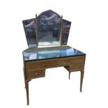 A 1930s painted oak dressing table, the back with shaped bevelled mirrors on tapering columns with