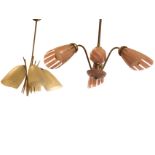 A 60s hanging light fitting with three shaped pink glass shades supported on ribbed brass brackets