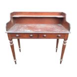 A Victorian mahogany washstand, the shaped gallery back with shelf above a pair of knobbed dummy