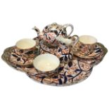 A Royal Crown Derby style cabaret or early morning tea-for-two set, decorated in the traditional