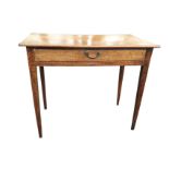 An antique mahogany side table with thin plain top above a long frieze drawer mounted with brass