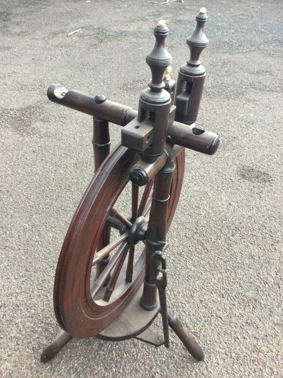 A nineteenth century mahogany spinning wheel with turned spindles raised above an oval platform with - Image 3 of 3