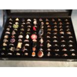A box of a hundred miscellaneous silver rings set with semi-precious stones - 925 marks. (100)