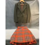 A ladies tartan kilt and moss green wool jacket, the kilt by WM Anderson & Sons Ltd of Edinburgh and