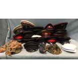 Two boxes of miscellaneous military caps including peaked, camouflage, hats, police, RAF, Russian,