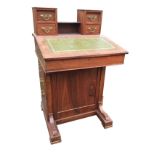 A Victorian mahogany davenport with small drawers flanking shelf to back, the desk with gilt