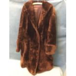 A faux fur coat with wide collar & cuffs - lined. (43in collar to hem)
