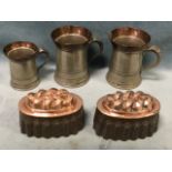 A set of three Victorian Gaskells pewter tankards with flared copper rims; and a pair of copper