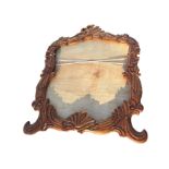 A large carved mirror frame with leaf scrolled decoration. (63in x 48in)