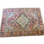 An Anatolian rug woven with central floral star medallion on red field with linked foliage, having