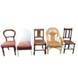 A Victorian mahogany baloonback dining chair on turned legs; a painted Lloyd Loom style chair with