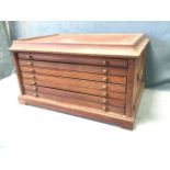 A C20th mahogany coin/medal collectors cabinet with tray top above concave moulding and six brass