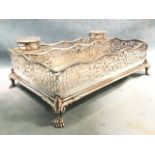 A rectangular silver plated antique desk stand with scalloped pierced fretwork galleries having bead