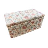 A Victorian blanket box type ottoman with later upholstery, the cushion seat with brass hinges,