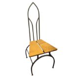 Tim Roper, a gothic shaped wrought iron and oak hall chair, with tapering two-piece seat on arched