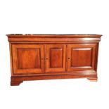 A reproduction mahogany sideboard having rectangular rounded top above three cushion moulded