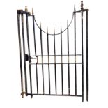 A cast iron garden gate with side posts, the vertical square spindles with spear finials, having