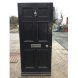 A heavy traditional six panel painted front door having brass knocker, letterbox, three hinges &