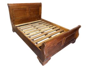 A mahogany sleigh bed, the shaped twin panelled headboard & tailboard with plain side rails,
