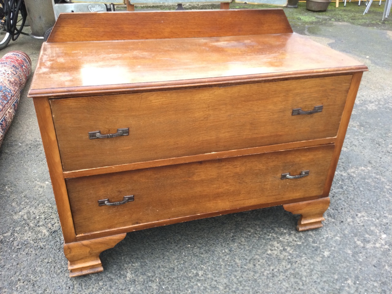 An oak dressing table with easel mirror to top flanked by hinged wings, the chest with two long - Image 2 of 3