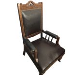 A late Victorian mahogany armchair in original upholstery, with scroll carved pierced back rail