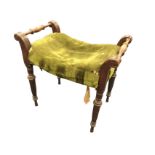 A nineteenth century upholstered mahogany stool, the rectangular seat flanked by turned spindles