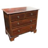 An Edwardian mahogany chest of drawers inlaid with chequered stringing, the rectangular moulded top