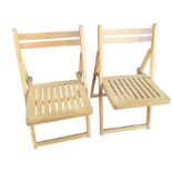 A pair of folding chairs with curved bar backs and slatted seats on rectangular legs. (2)