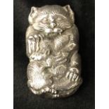 A heavy sterling silver vesta embossed as a cat with rat, having sprung hinged lid - 82g. (2.75in)