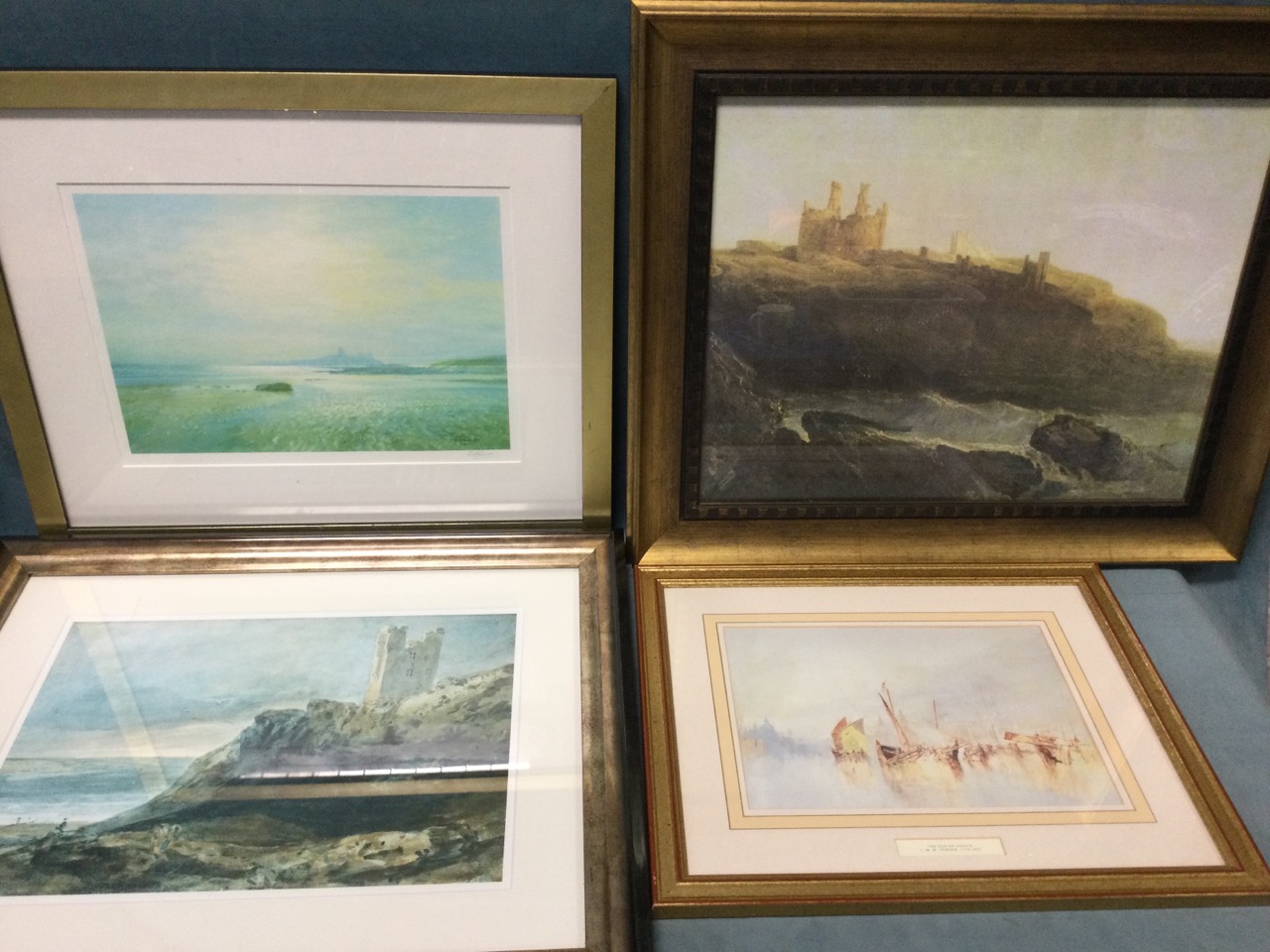 A signed, mounted, framed Walter Holmes print of Dunstanburgh Castle from Low Newton; another gilt